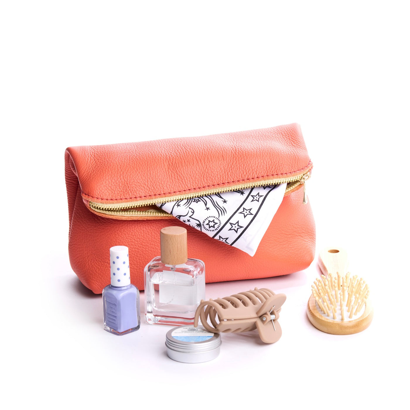 Coral | Closed folded zipper pouch with items