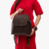 Coldbrew | Model wearing a leather backpack on a white background