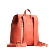 Coral | Leather backpack with magnetic flap closure on a white 