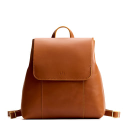 Honey | Leather backpack with magnetic flap closure on a white 