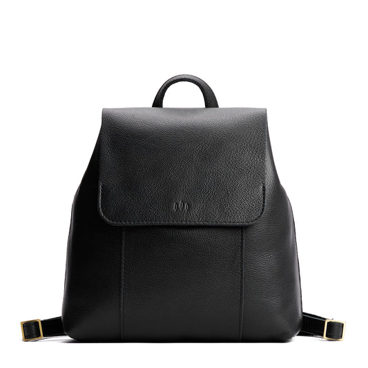 Pebbled--black | Leather backpack with magnetic flap closure on a white 
