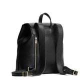 Pebbled--black | Leather backpack with magnetic flap closure on a white 