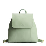 Pistachio | Leather backpack with magnetic flap closure on a white 