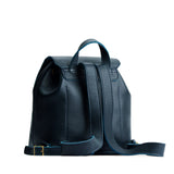 Boreal | Back of drawstring bucket backpack with snap closure under flap