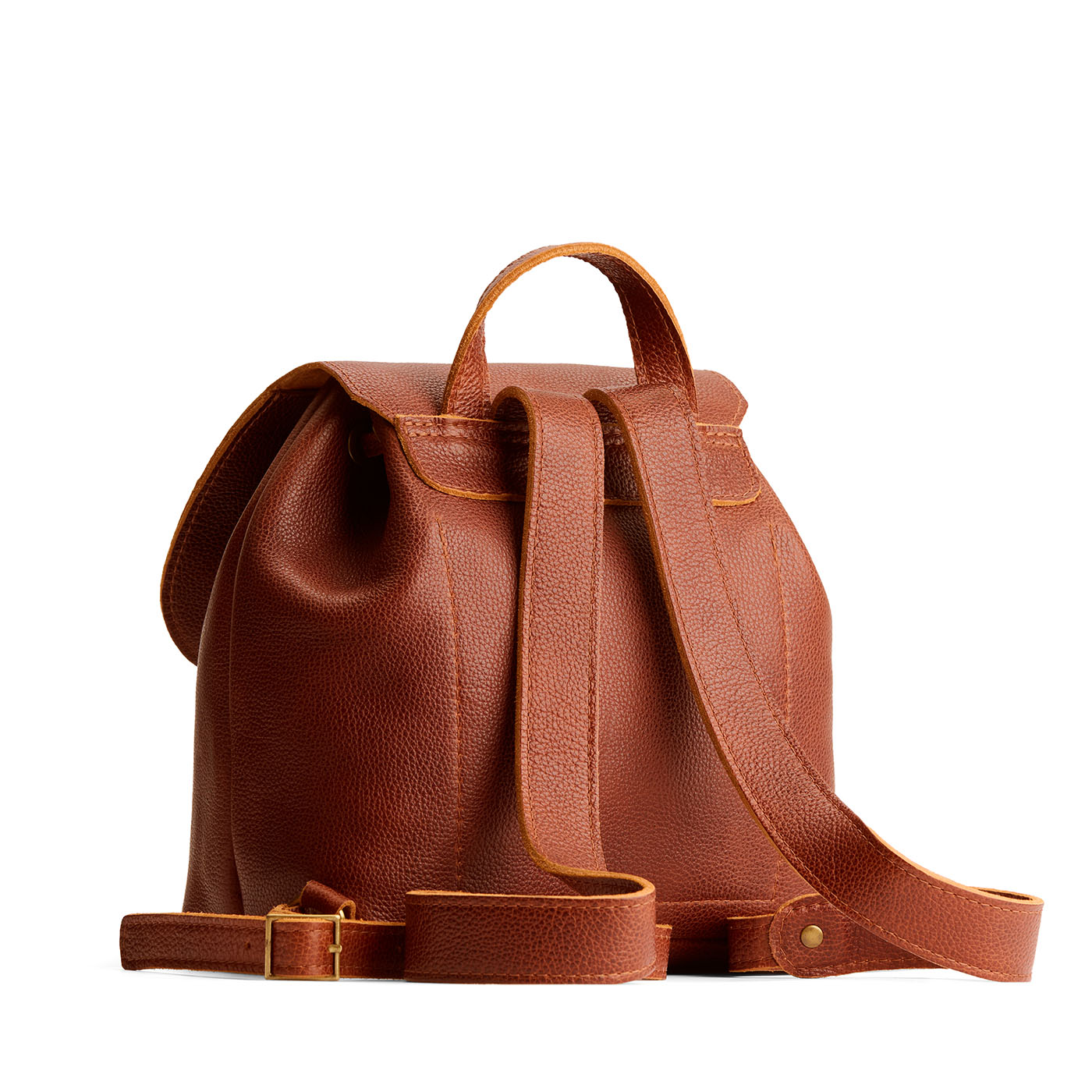 Nutmeg | Back of drawstring bucket backpack with snap closure under flap