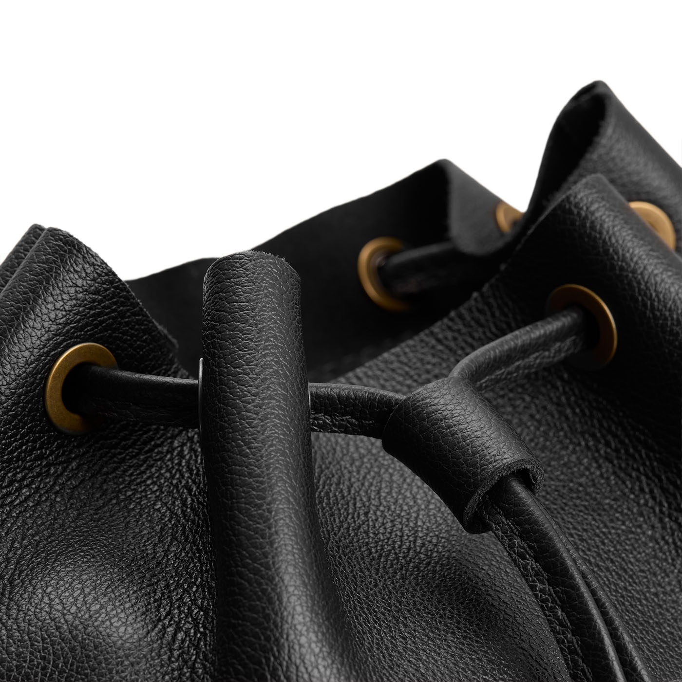 Pebbled--black | Close up of drawstring bucket backpack with grommets