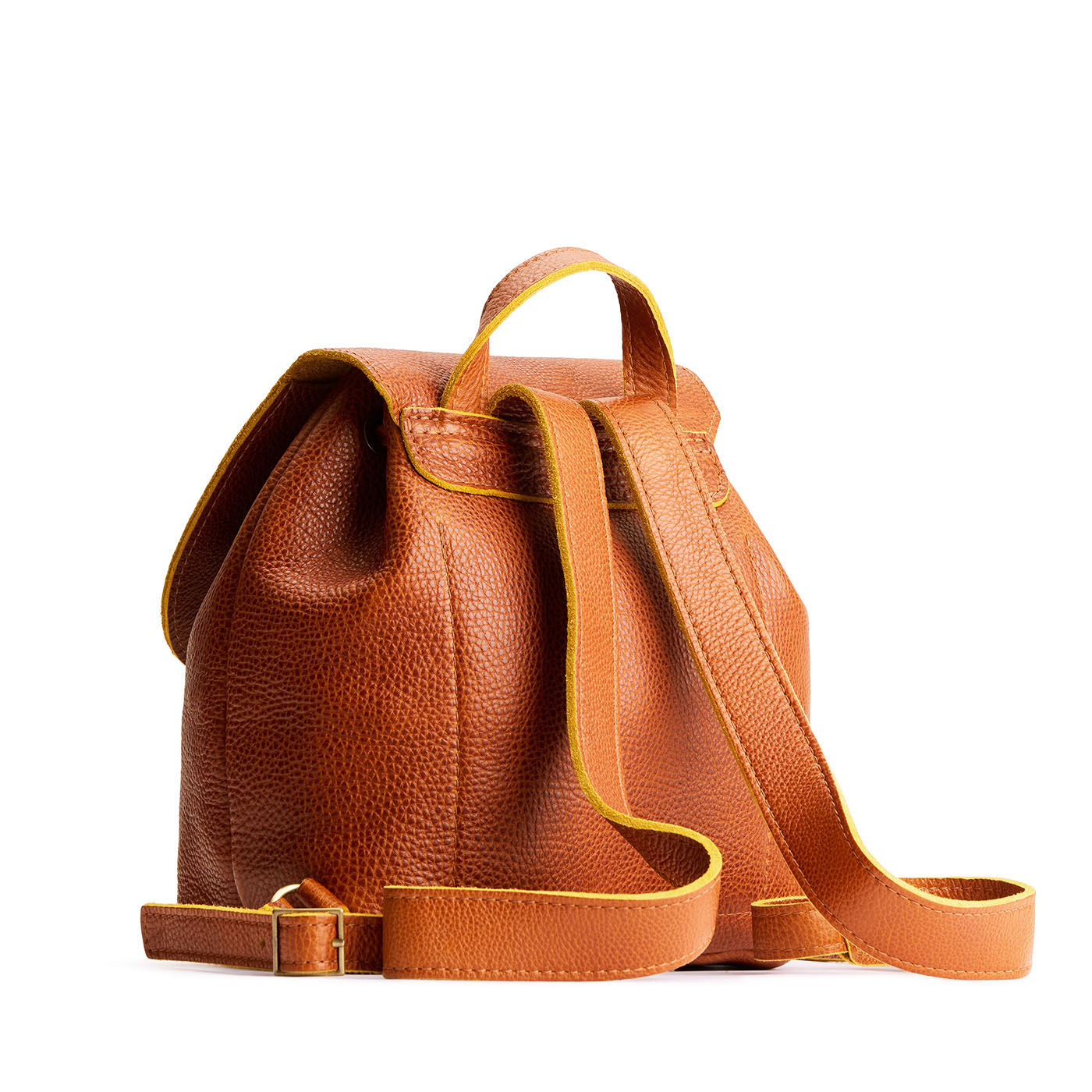 Sienna | Back of drawstring bucket backpack with snap closure under flap