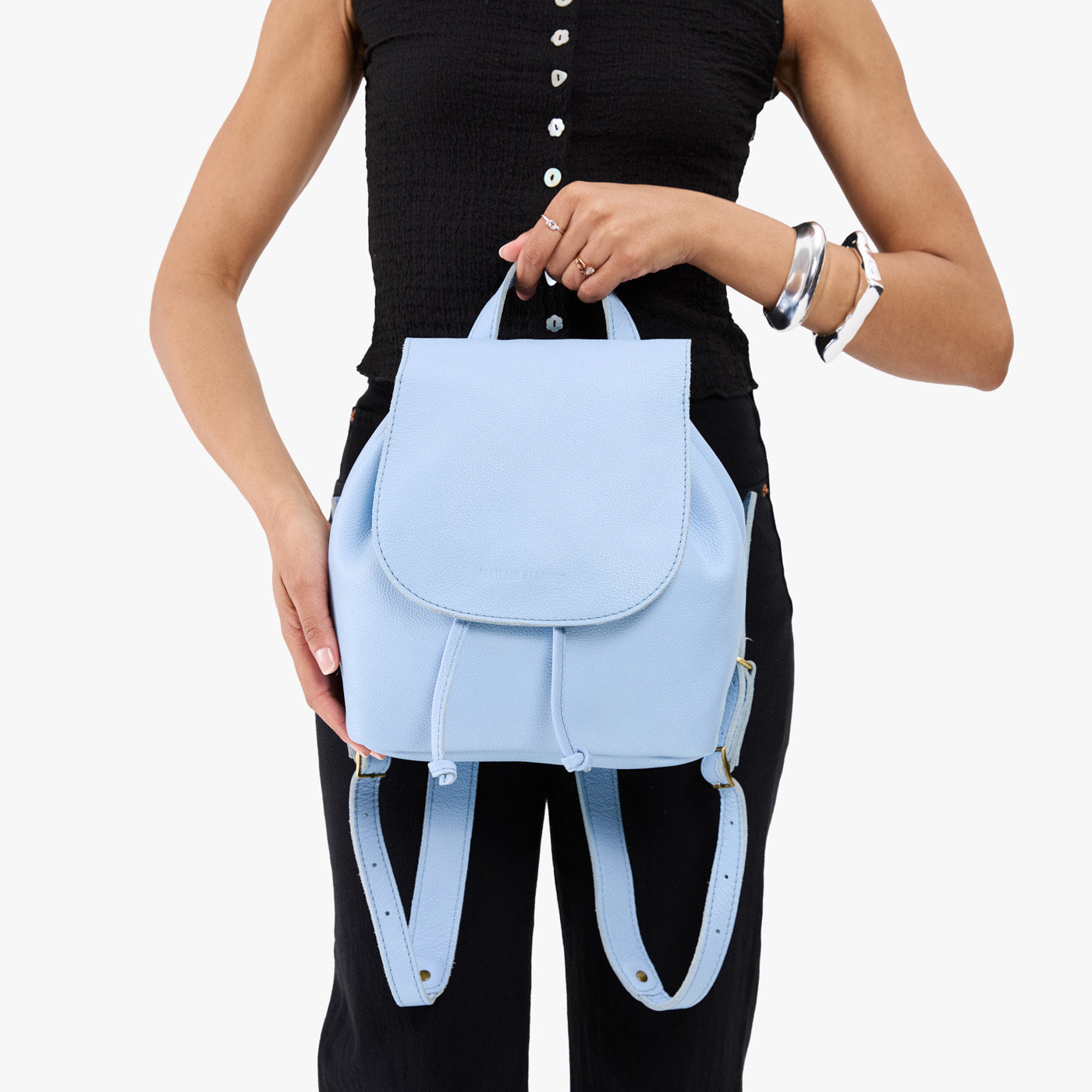 blue leather drawstring backpack Powder Woven Handcrafted with soft Italian Napa leather this multiway drawstring backpack is also a leather tote and shoulder bag. Tory Burch Sky Blue Pebbled