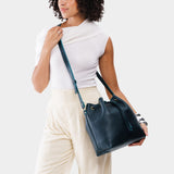 Boreal Large | Model holding slouchy crossbody bag with drawstring closure