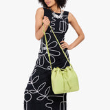 Shadow Lime Large | Model wearing slouchy crossbody bag with drawstring closure