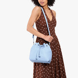 Skyway Large | Model wearing slouchy crossbody bag with drawstring closure