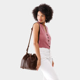 Coldbrew Large | Model wearing slouchy crossbody bag with drawstring closure