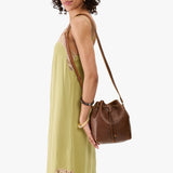 Asheville Small | Model wearing slouchy crossbody bag with drawstring closure