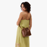 Asheville Small | Model wearing slouchy crossbody bag with drawstring closure