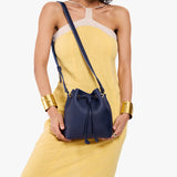Cobalt Small | Model wearing slouchy crossbody bag with drawstring closure