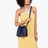 Cobalt Small | Model wearing slouchy crossbody bag with drawstring closure