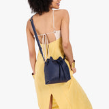 Cobalt Small | Model wearing slouchy crossbody bag with drawstring closure