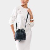 Boreal Small | Model wearing slouchy crossbody bag with drawstring closure