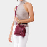 Orchid Small | Model wearing slouchy crossbody bag with drawstring closure