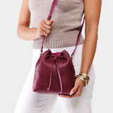 Orchid Small | Model wearing slouchy crossbody bag with drawstring closure