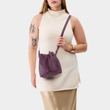Plum Small | Model wearing slouchy crossbody bag with drawstring closure