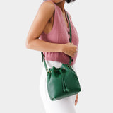 Bacalar Small | Model wearing slouchy crossbody bag with drawstring closure