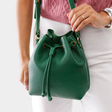 Bacalar Small | Model holding slouchy crossbody bag with drawstring closure