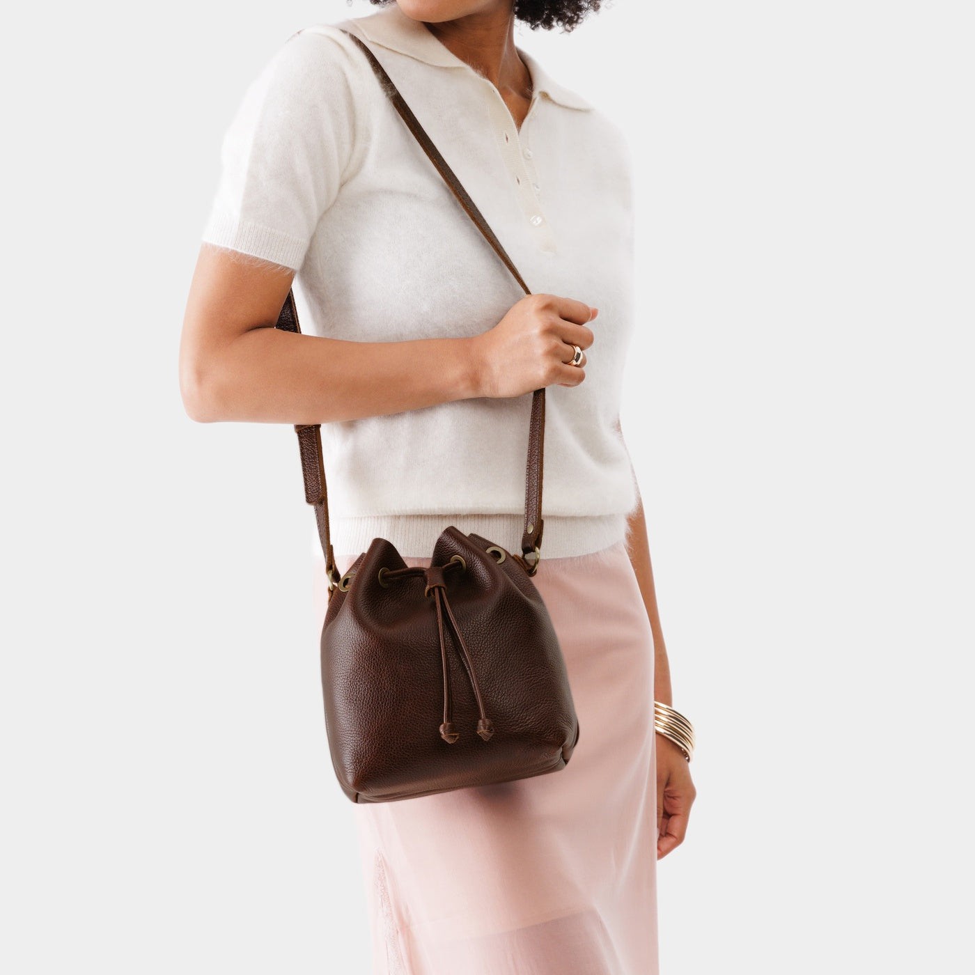 Coldbrew*Small | Model wearing slouchy crossbody bag with drawstring closure