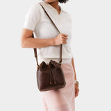Coldbrew Small | Model wearing slouchy crossbody bag with drawstring closure