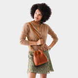 Sienna Small | Model wearing slouchy crossbody bag with drawstring closure