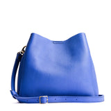 Astro Blue | symmetrical bucket bag with latch closure and removable crossbody strap