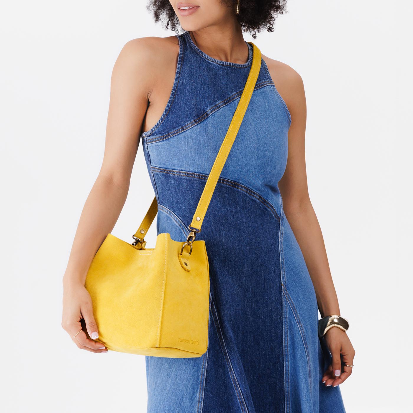 Hello Yellow | symmetrical bucket bag with latch closure and removable crossbody strap