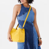 Hello Yellow | symmetrical bucket bag with latch closure and removable crossbody strap