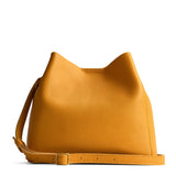 Sunshine | Symmetrical bucket bag with latch closure and removable crossbody strap