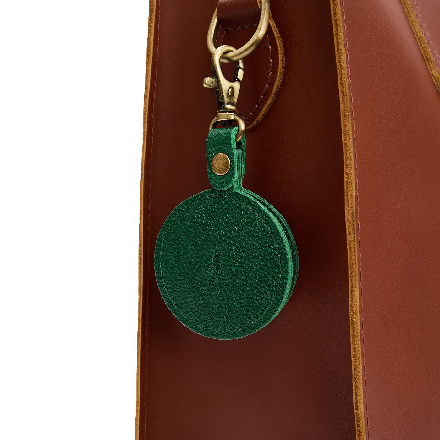 Bacalar | Circle-shaped airtag holder keychain with a swivel lobster clasp on bag