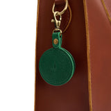 Bacalar | Circle-shaped airtag holder keychain with a swivel lobster clasp on bag