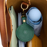 Bacalar | Circle-shaped airtag holder keychain with a swivel lobster clasp