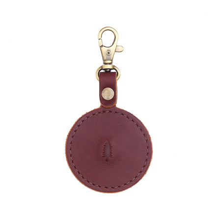 Cognac | Circle-shaped airtag holder keychain with a swivel lobster clasp