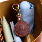 Nutmeg | Circle-shaped airtag holder keychain with a swivel lobster clasp