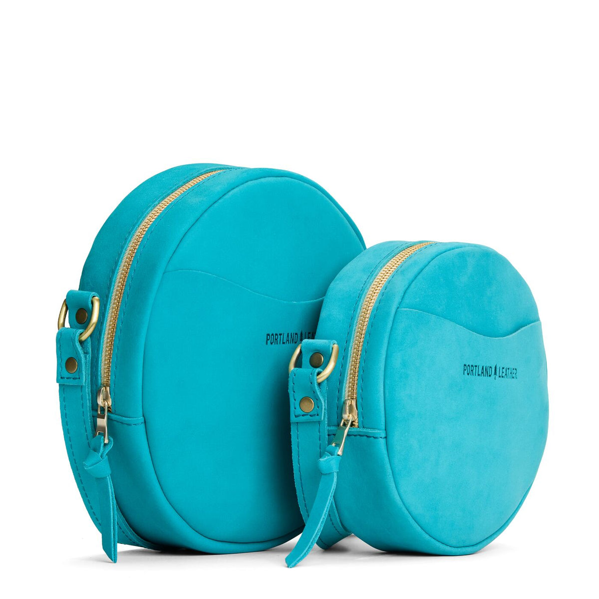 Aquamarine | Size comparison image of small and large circle shaped crossbody bags with top zipper