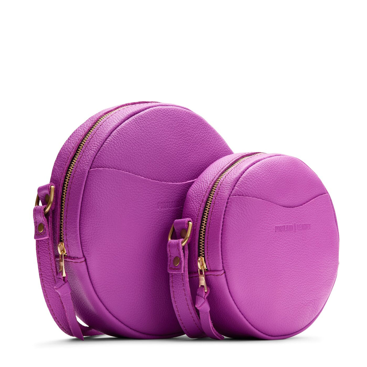 Cattleya | Size comparison image of small and large circle shaped crossbody bags with top zipper