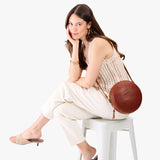Nutmeg Large | Circle shaped crossbody bag with top zipper