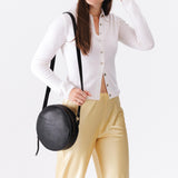 Circle shaped crossbody bag with top zipper