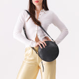 Circle shaped crossbody bag with top zipper