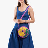 Wildflower Cattleya Large | Model wearing circle shaped crossbody bag with top zipper