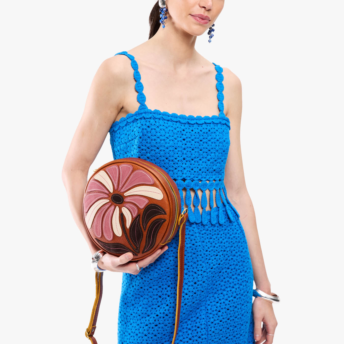 Wildflower Sienna*Large | Model holding circle shaped crossbody bag with top zipper
