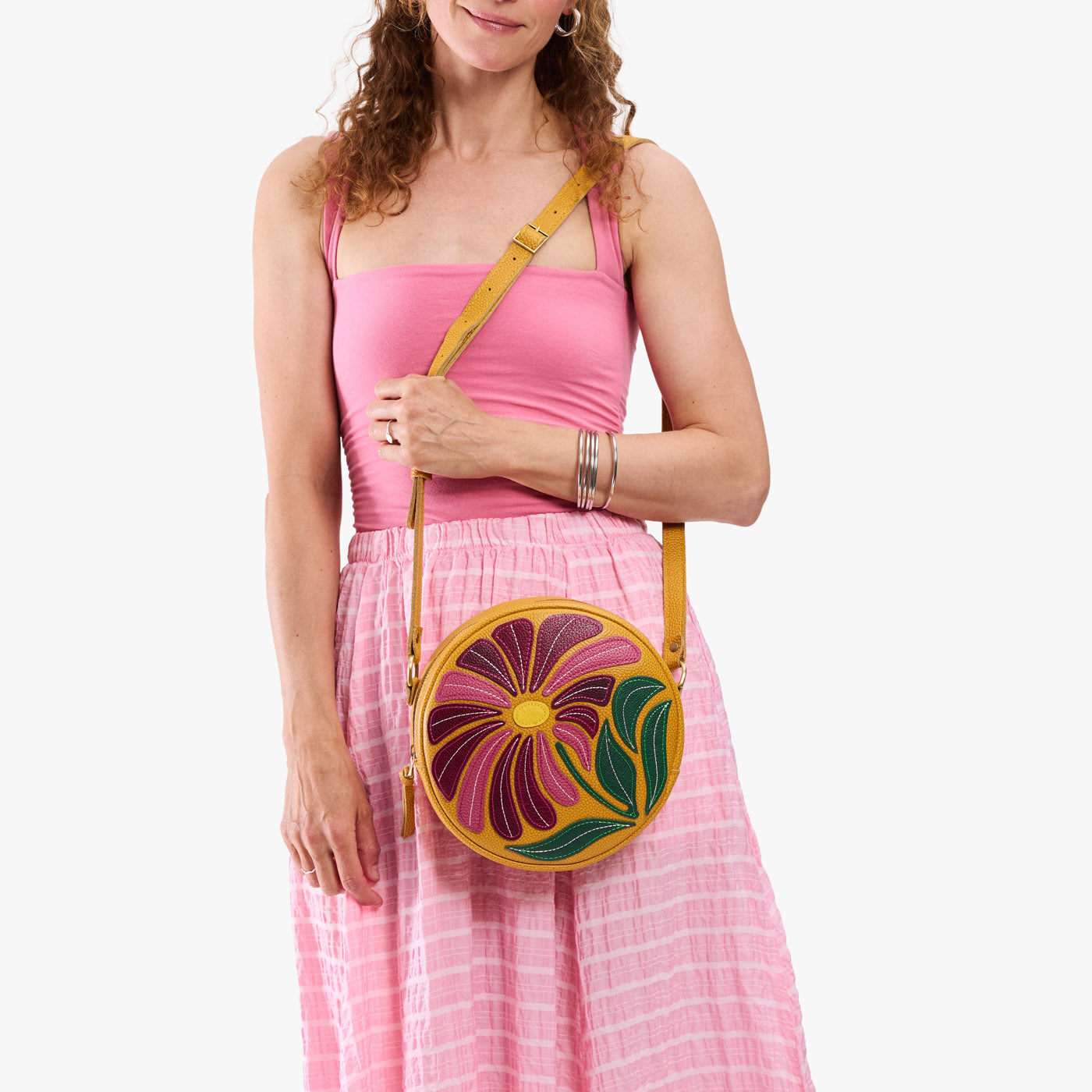 Wildflower Sunshine*Large | Model wearing circle shaped crossbody bag with top zipper