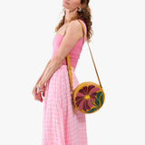 Wildflower Sunshine Large | Model wearing circle shaped crossbody bag with top zipper