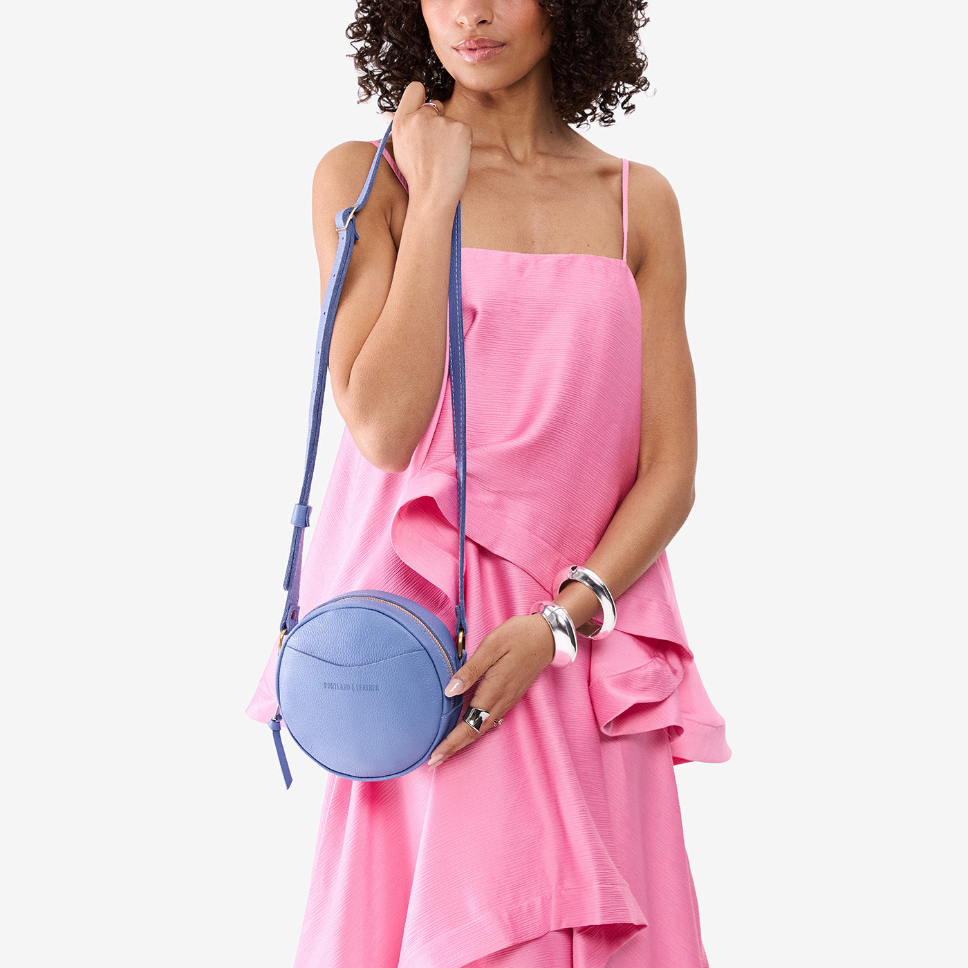 Aster*Small | Model wearing circle shaped crossbody bag with top zipper
