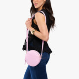 Pinkaboo Small | Model wearing circle shaped crossbody bag with top zipper